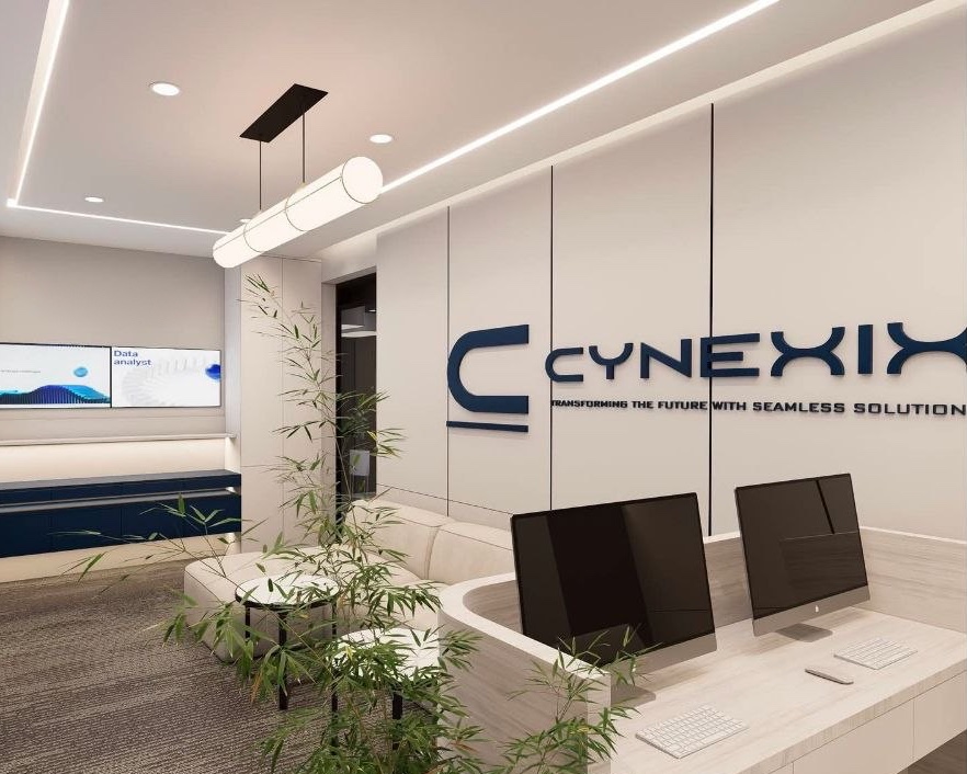 CYNEXIX reception with the company logo on the wall, a reception desk and a seating area