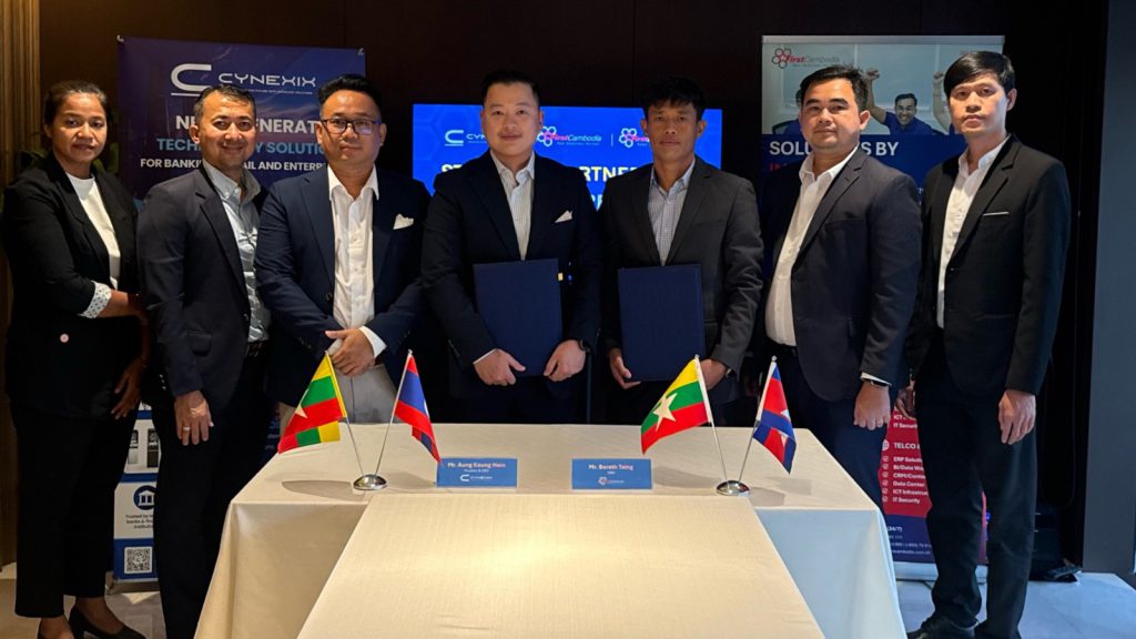 Aung Kaung Hein and Borath Taing with colleagues after the signing ceremony.