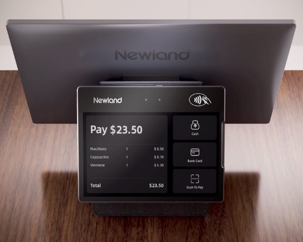 Newland POS terminal on a counter showing a $23.50 payment, with its main display behind