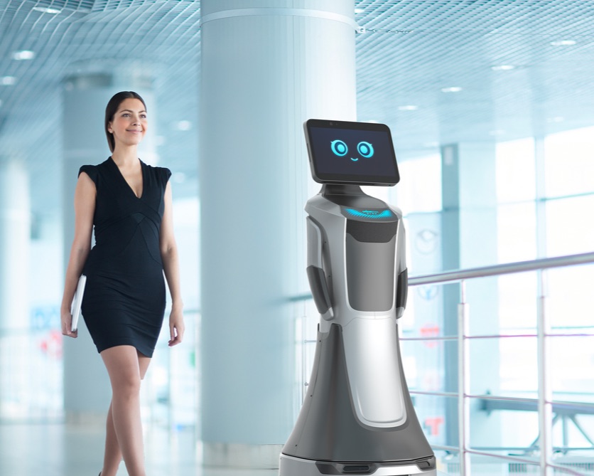 Service robot greeting a visitor in a building lobby