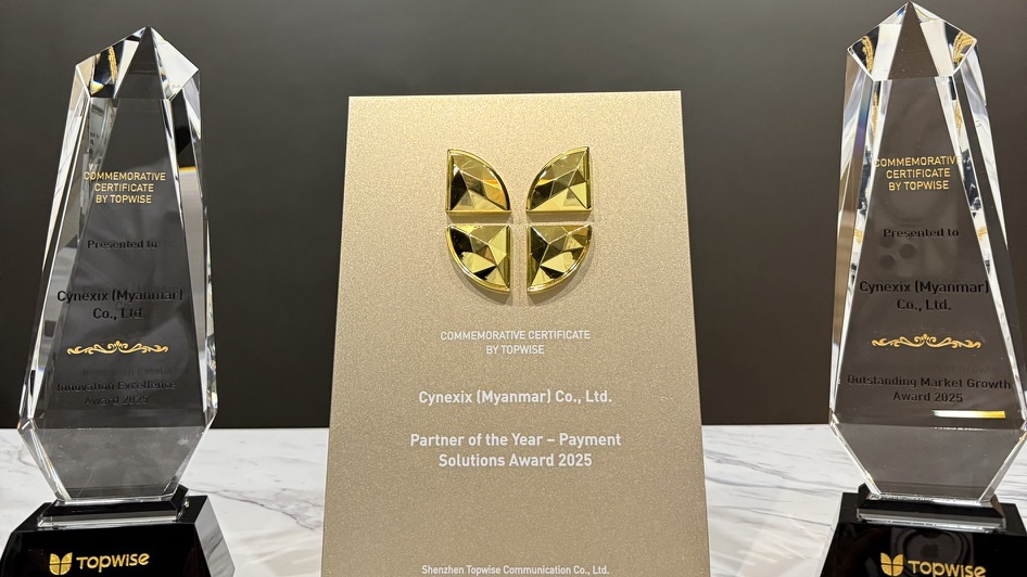 The three 2025 awards from Topwise to Cynexix (Myanmar) Co., Ltd.: the Partner of the Year – Payment Solutions certificate between two crystal trophies.